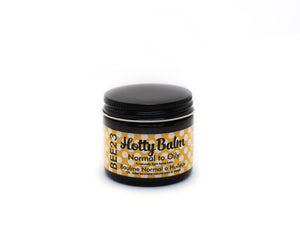 Our Normal to Oily Hotty Balm is recommended for normal, combination, young and acne-prone skin. It creates a beautiful natural glow that customers love to rave about. This balm does more than moisturize, it hydrates. Hydration helps to reduce the production of oil and balance the pH of the skin. Our blends melt into the skin, however, acts like a barrier in harsh elements, from pollutants and in soothing inflamed skin or rosacea. It has become known as a gorgeous, lightweight natural primer under makeup.